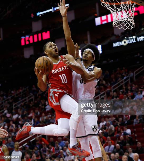 Eric Gordon of the Houston Rockets drives past Jarrett Allen of the Brooklyn Nets at Toyota Center on January 16, 2019 in Houston, Texas. NOTE TO...