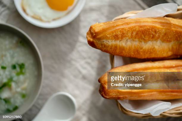 youtiao and  porridge - youtiao stock pictures, royalty-free photos & images