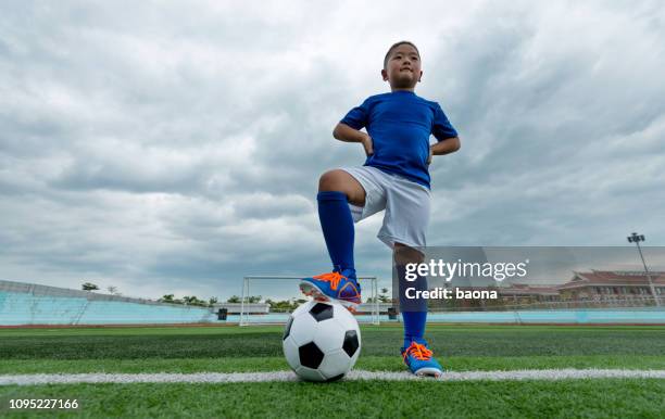 young football player waiting for kick off - kids socks stock pictures, royalty-free photos & images