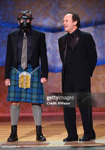 Robin Williams appears on stage with gas mask with Billy Crystal; "On Stage at the Kennedy Center: The Mark Twain Prize" will air November 21, at 9...