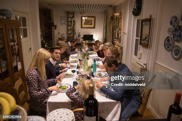 family at diner - big family dinner stock pictures, royalty-free photos & images