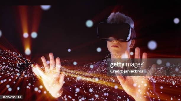 man exploring virtual reality. vr headset. cosmic dust - spark imagination stock pictures, royalty-free photos & images