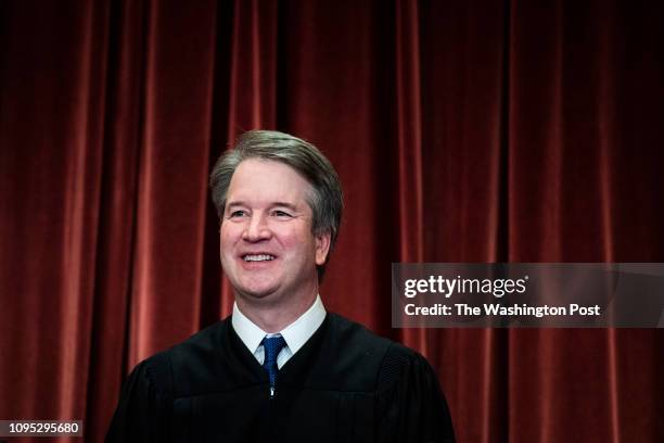 Associate Justice Brett M. Kavanaugh poses with other Justices of the United States Supreme Court during their official group photo at the Supreme...