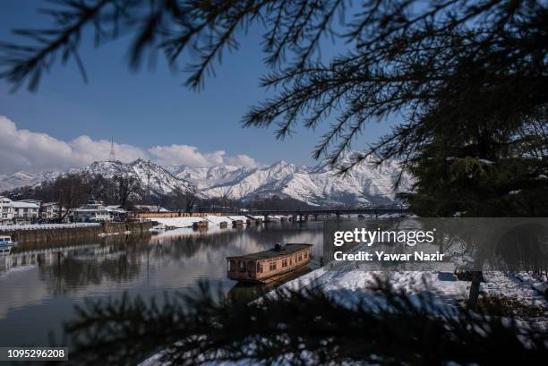 General view of snow clad mountain range during a sunny day on February 08, 2019 in Srinagar, the summer capital of Indian Administered Kashmir,...