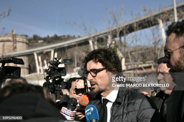 Italys Infrastructure and Transport Minister Danilo Toninelli addresses reporters as he visits the demolition site of the western section of the...