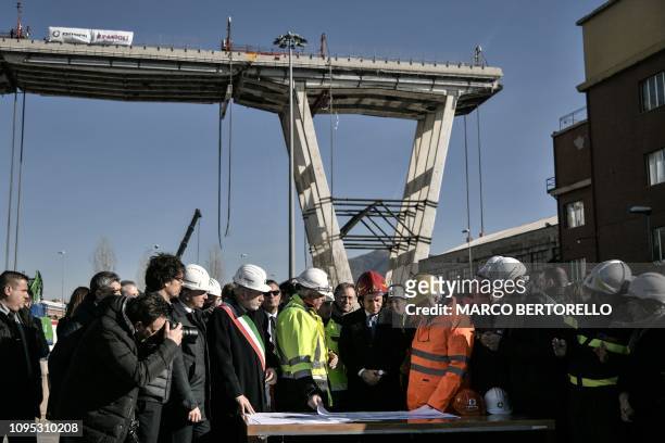 Italys Prime Minister Giuseppe Conte , Genoa's mayor Marco Bucci and Italys Infrastructure and Transport Minister Danilo Toninelli listen to experts...