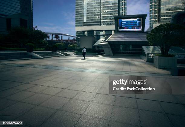 mixed business and residential district with large billboard display at dawn - city square stock pictures, royalty-free photos & images