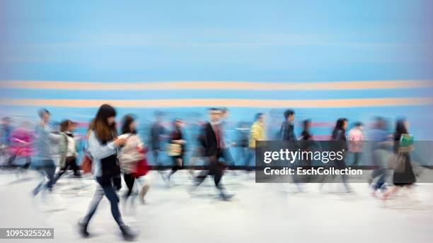 busy colorful morning commute in hong kong - large group of people walking stock pictures, royalty-free photos & images