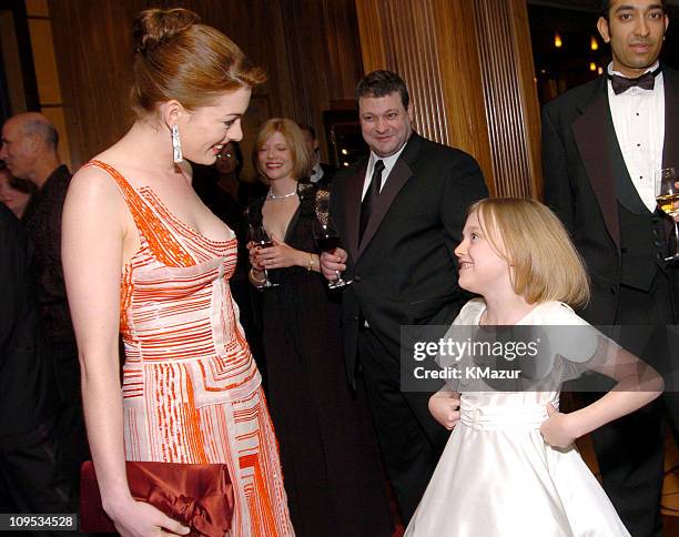 Anne Hathaway and Dakota Fanning during Entertainment Industry Foundation's Colon Cancer Benefit on the QM2 - VIP Cocktail Hour at Queen Mary 2 in...