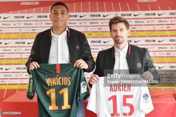 Monaco's Brazilian forward Carlos Vinicius and Monaco's Portuguese midfielder Adrien Silva pose with their new jersey in la Turbie ASM training camp...