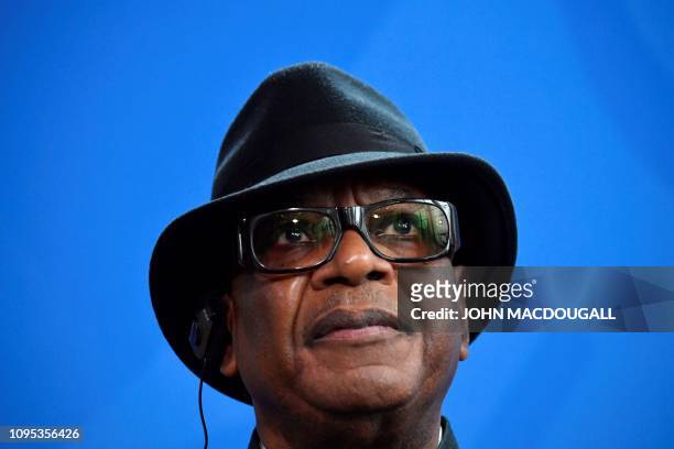 Malian President Ibrahim Boubacar Keita listens during a joint press conference with German Chancellor on February 8, 2019 in Berlin.