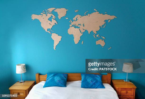 world map in a bedroom - australia australasia foto e immagini stock