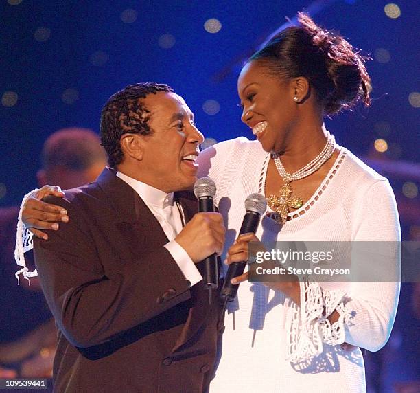 Hosts Smokey Robinson and Yolanda Adams during their opening duet performance during a taping for the 2001 Soul Train Christmas Starfest at the Santa...