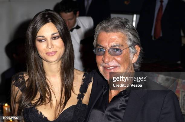 Manuela Arcuri and Robero Cavalli during 2003 Cannes Film Festival - Roberto Cavalli Fashion Show - Dinner at Palm Beach in Cannes, France.