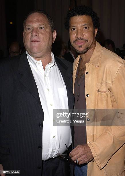 Harvey Weinstein and Lionel Richie during 2003 Cannes Film Festival - Roberto Cavalli Fashion Show - Dinner at Palm Beach in Cannes, France.