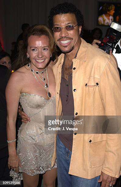 Caroline Gruosi-Scheufele and Lionel Richie during 2003 Cannes Film Festival - Roberto Cavalli Fashion Show - Dinner at Palm Beach in Cannes, France.
