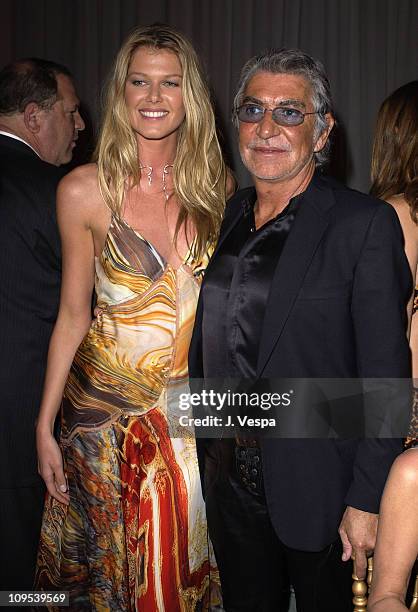 Ingrid Seynhaeve and Roberto Cavalli during 2003 Cannes Film Festival - Roberto Cavalli Fashion Show - Dinner at Palm Beach in Cannes, France.