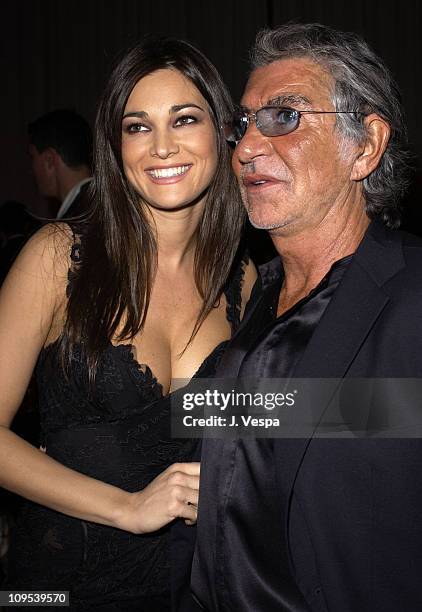 Manuela Arcuri and Roberto Cavalli during 2003 Cannes Film Festival - Roberto Cavalli Fashion Show - Dinner at Palm Beach in Cannes, France.