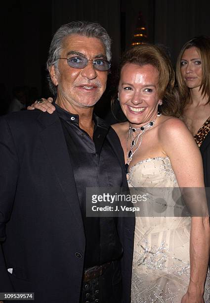 Roberto Cavalli and Caroline Gruosi-Scheufele during 2003 Cannes Film Festival - Roberto Cavalli Fashion Show - Dinner at Palm Beach in Cannes,...