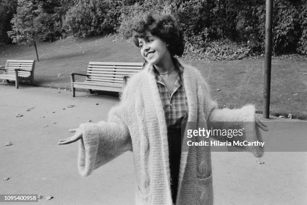 English musician and lead singer of the band X-Ray Spex, Poly Styrene in a park before attending the 'Women of the Year Lunch', London, UK, 26th...