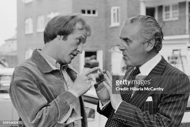 English actors Dennis Waterman as 'Terry McCann' and George Cole as 'Arthur Daley' on the set of comedy-drama television series 'Minder', UK, 20th...