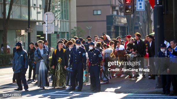 japanese new adults wearing kimonos on 'coming of age day' on the street in yokohama - japan coming of age day 2019 stock pictures, royalty-free photos & images