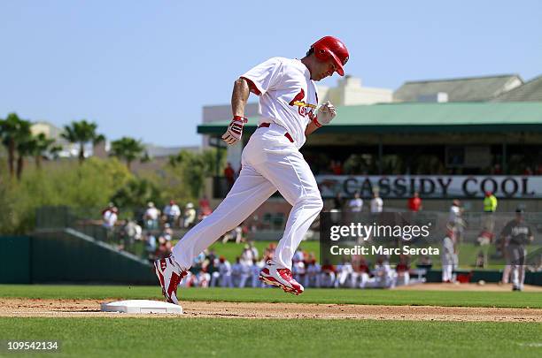 Lance Beirkman of the St. Louis Cardinals hits a home run against the Florida Marlins at Roger Dean Stadium on February 28, 2011 in Jupiter, Florida.