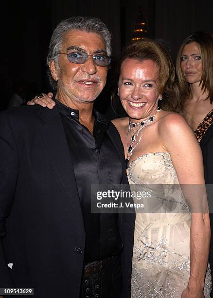 Roberto Cavalli and Caroline Gruosi-Scheufele during 2003 Cannes Film Festival - Roberto Cavalli Fashion Show - Dinner at Palm Beach in Cannes,...