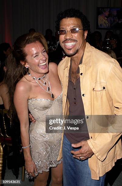 Caroline Gruosi-Scheufele and Lionel Richie during 2003 Cannes Film Festival - Roberto Cavalli Fashion Show - Dinner at Palm Beach in Cannes, France.