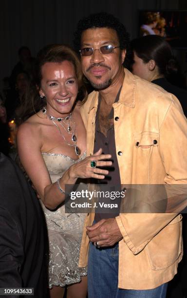 Caroline Gruosi-Scheufele and Lionel Richie during 2003 Cannes Film Festival - Roberto Cavalli Fashion Show - Dinner at Palm Beach in Cannes, France.