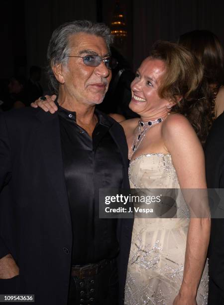 Roberto Cavalli and Caroline Gruosi-Scheufele during 2003 Cannes Film Festival - Roberto Cavalli Fashion Show - Dinner at Palm Beach in Cannes,...