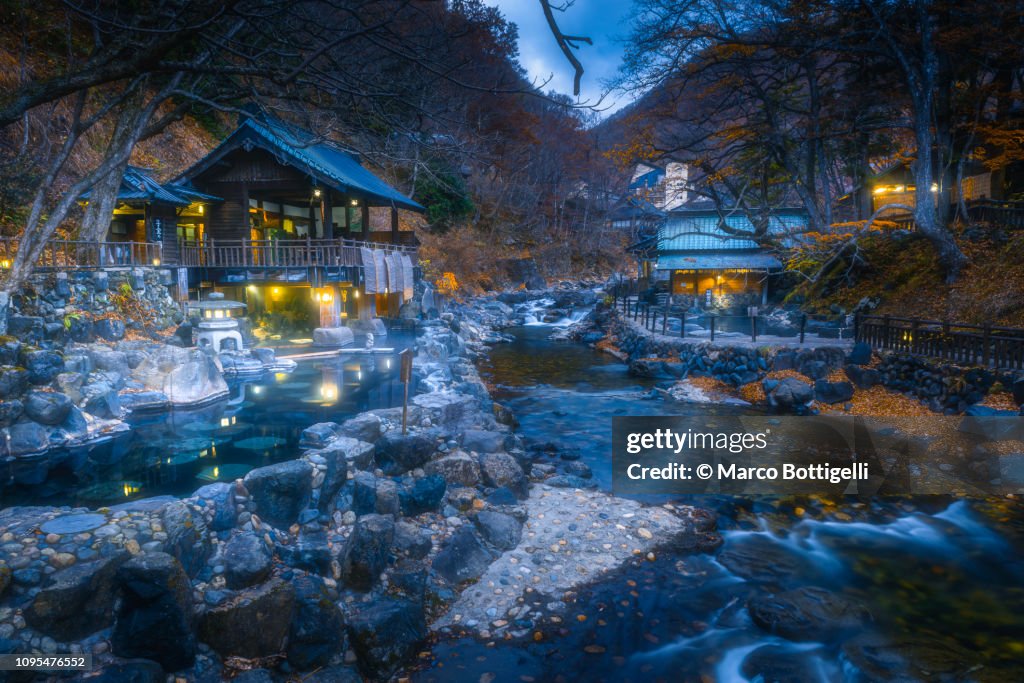 Japanese hot spring (Onsen) illuminated at dusk, Japan