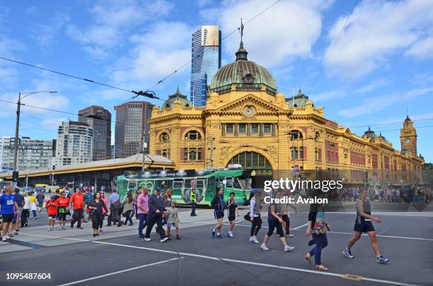 Pedestrians cross Flinders Street towards Flinders Street railway stationIts on of the most busiest pedestrian crossings in Australia and the busiest...