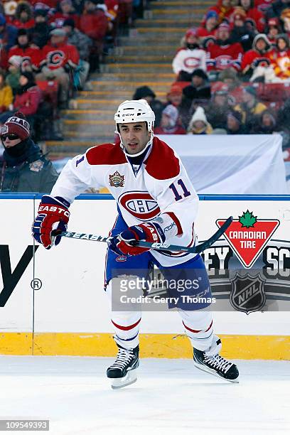 Scott Gomez of the Montreal Canadiens skates against the Calgary Flames on February 20, 2011 during the 2011 Heritage Classic at McMahon Stadium in...
