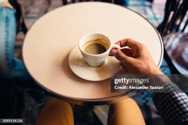 drinking coffee at the cafe, personal perspective view - vue subjective main photos et images de collection