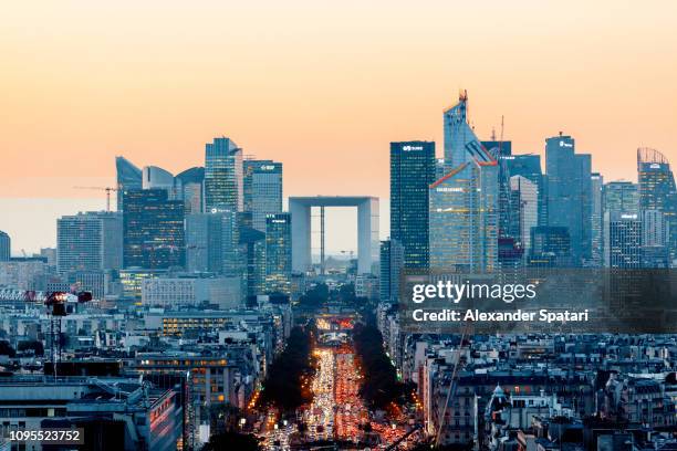 elevated view of illuminated skyscrapers at la defense financial district and avenue des champs-elysees at dusk, paris, france - グランダルシュ ストックフォトと画像