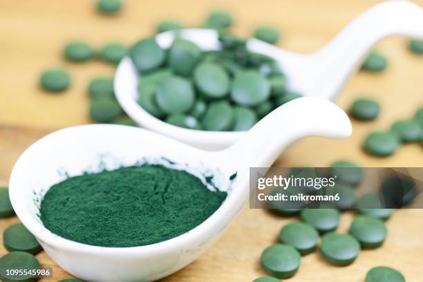 organic spirulina (blue-green algae) - chlorella stock pictures, royalty-free photos & images