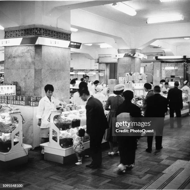 View of shoppers at a candy counter in Mitsukoshi's Department Store, Tokyo, Japan, 1966.
