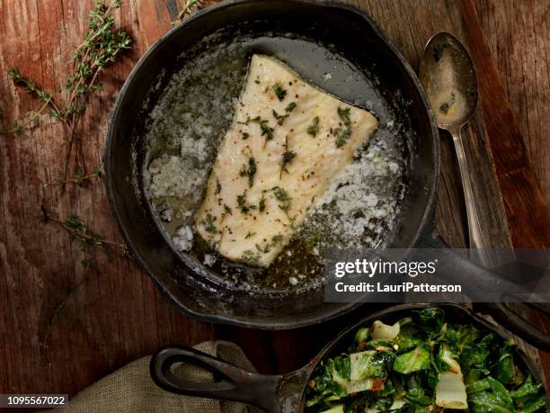 butter poached halibut with swiss chard - bacalhau imagens e fotografias de stock