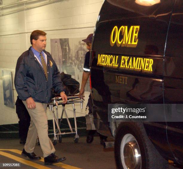 New York City Crime Scene Investigators stand by as officials from the medical examiners office prepare to transport the body of Eric Douglas. Eric...