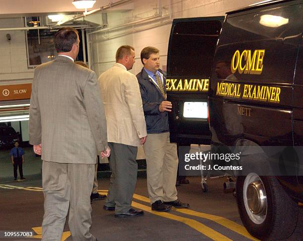 New York City Crime Scene Investigators stand by as officials from the medical examiners office load the body of Eric Douglas into Medical Examiners...