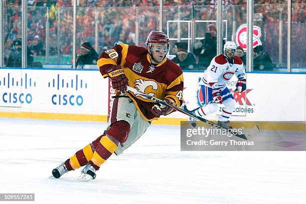 Alex Tanguay of the Calgary Flames skates against the Montreal Canadiens on February 20, 2011 during the 2011 Heritage Classic at McMahon Stadium in...