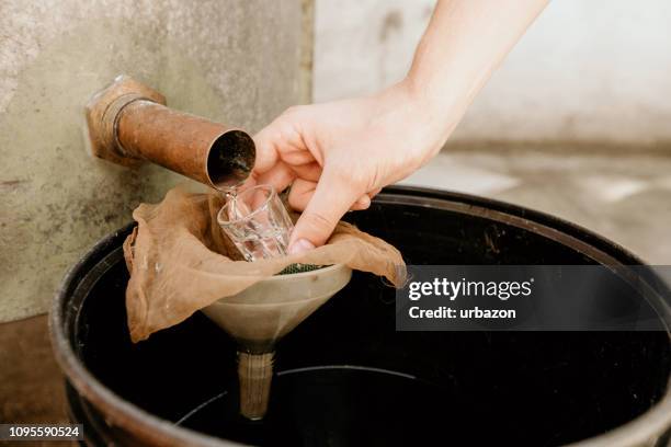 making moonshine schnapps - distillery stock pictures, royalty-free photos & images