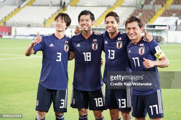 Yoshinori Muto and Tsukasa Shiotani and Muroya Sei and Toshihiro Aoyama celebrate winning during the AFC Asian Cup Group F match between Japan and...