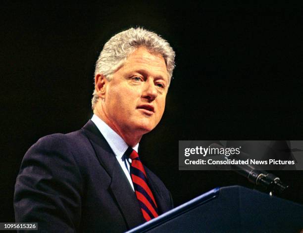 American politician US President Bill Clinton speaks from a podium at the Democratic Leadership Council's 1995 Annual Conference in the Washington...