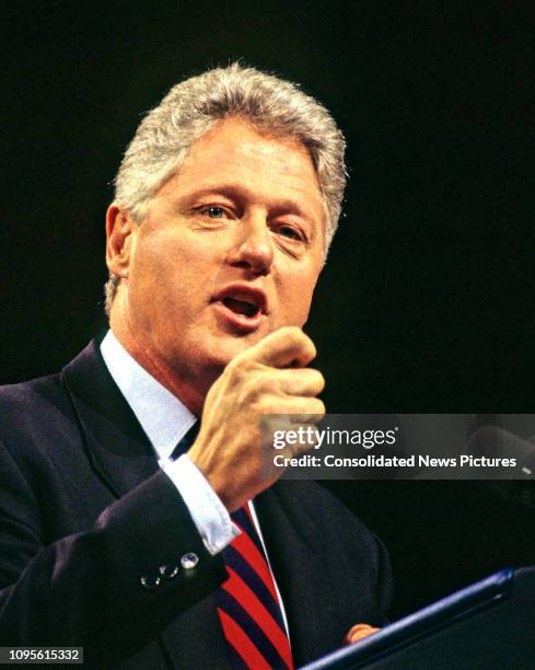 American politician US President Bill Clinton speaks from a podium at the Democratic Leadership Council's 1995 Annual Conference in the Washington...