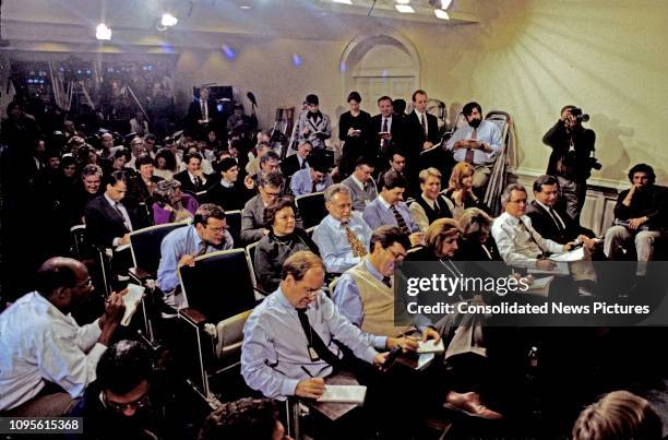 View of journalists in the White House's Press Room, Washington DC, November 13, 1995. Among those visible are, front row from left, Steve Holland ,...