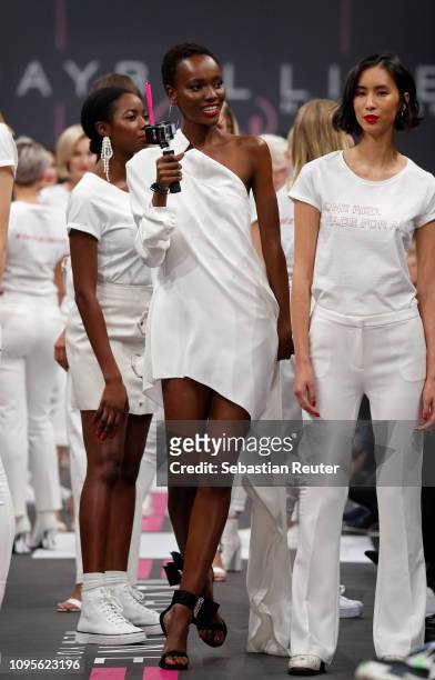 Model Herieth Paul walks the runway at the Maybelline New York show 'Make-up that makes it in New York' during the Berlin Fashion Week Autumn/Winter...
