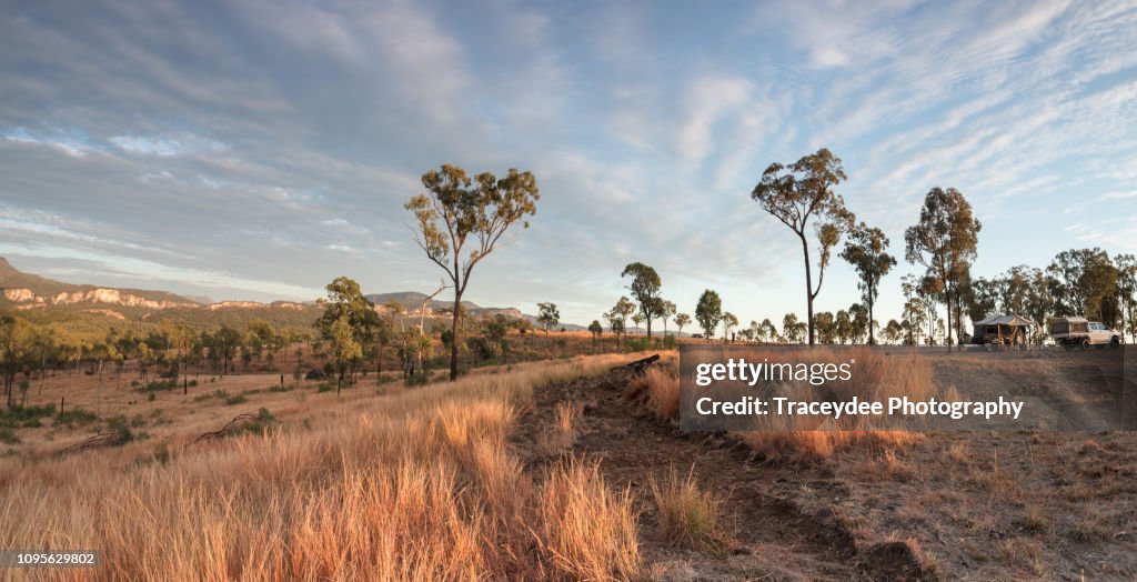 Sunrise off the Beaten track with a 4 Wheel drive vehicle and campervan in the Carnarvon Gorge, Queensland.