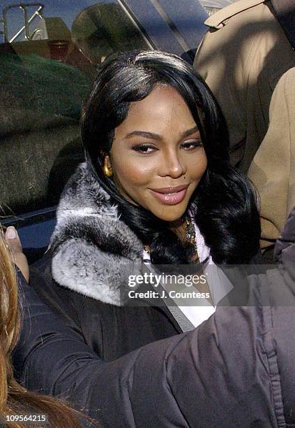 Rap star Lil' Kim, whose real name is Kimberly Jones, enters Manhattan federal court, Monday, March 14 in New York City. Jones is accused of lying to...